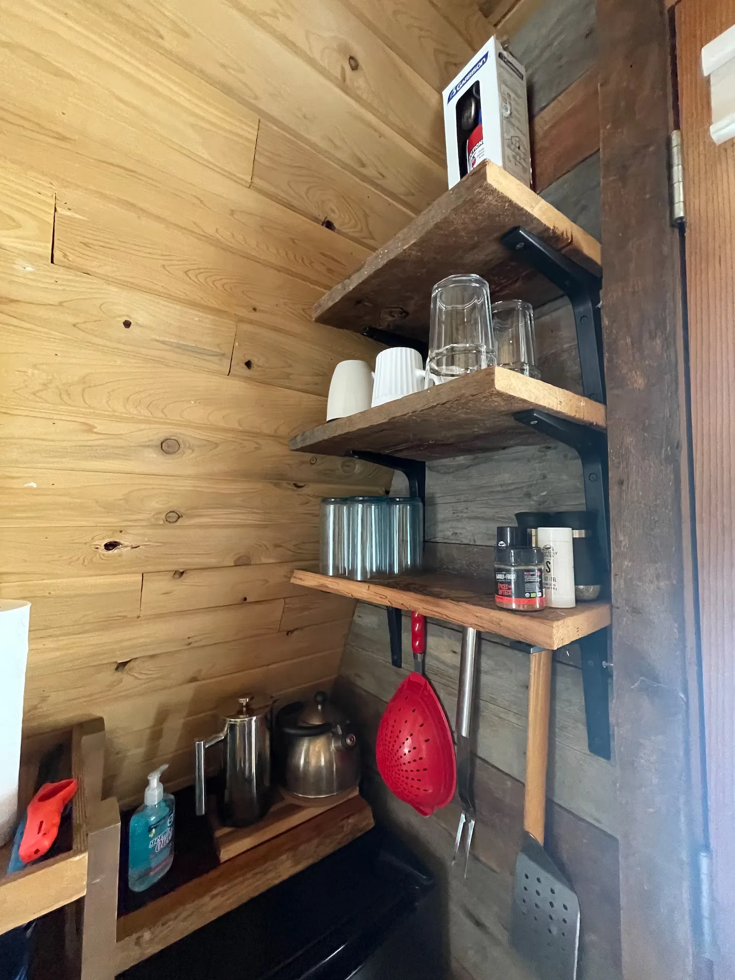 Charming kitchen shelves with mugs and utensils