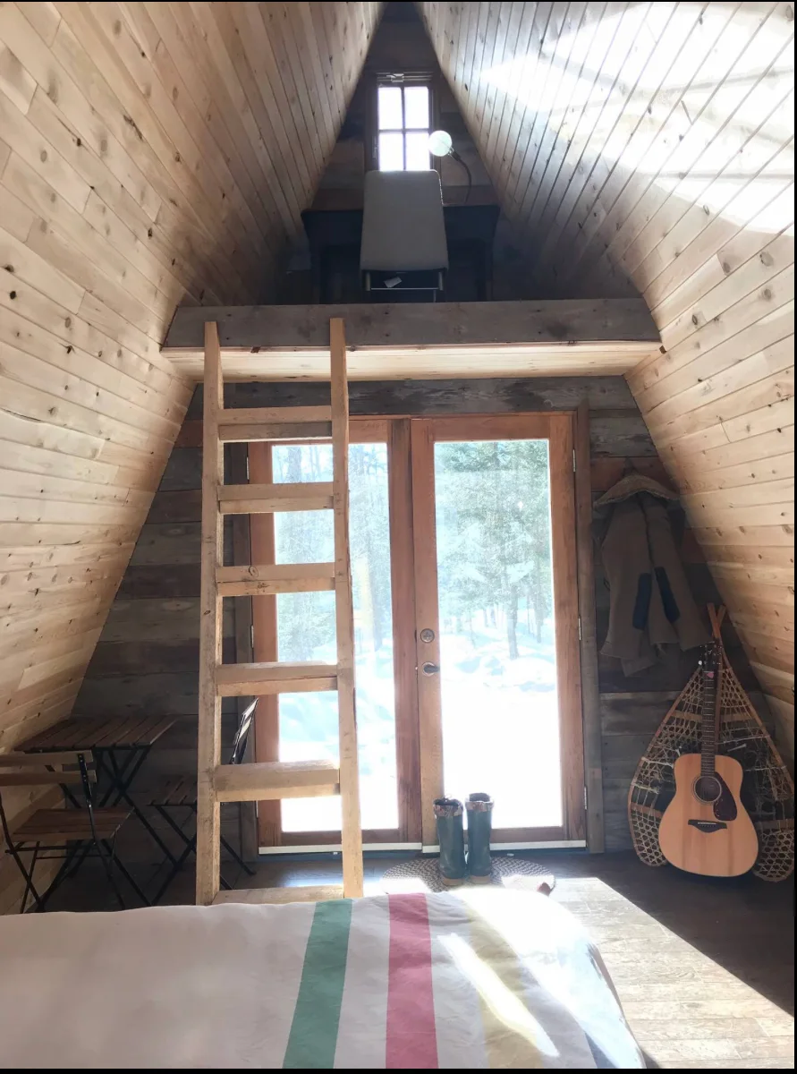 Interior — A-frame loft, ladder, guitar and snowshoes