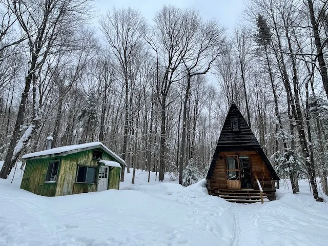 A-Frame cabin exterior in winter snow